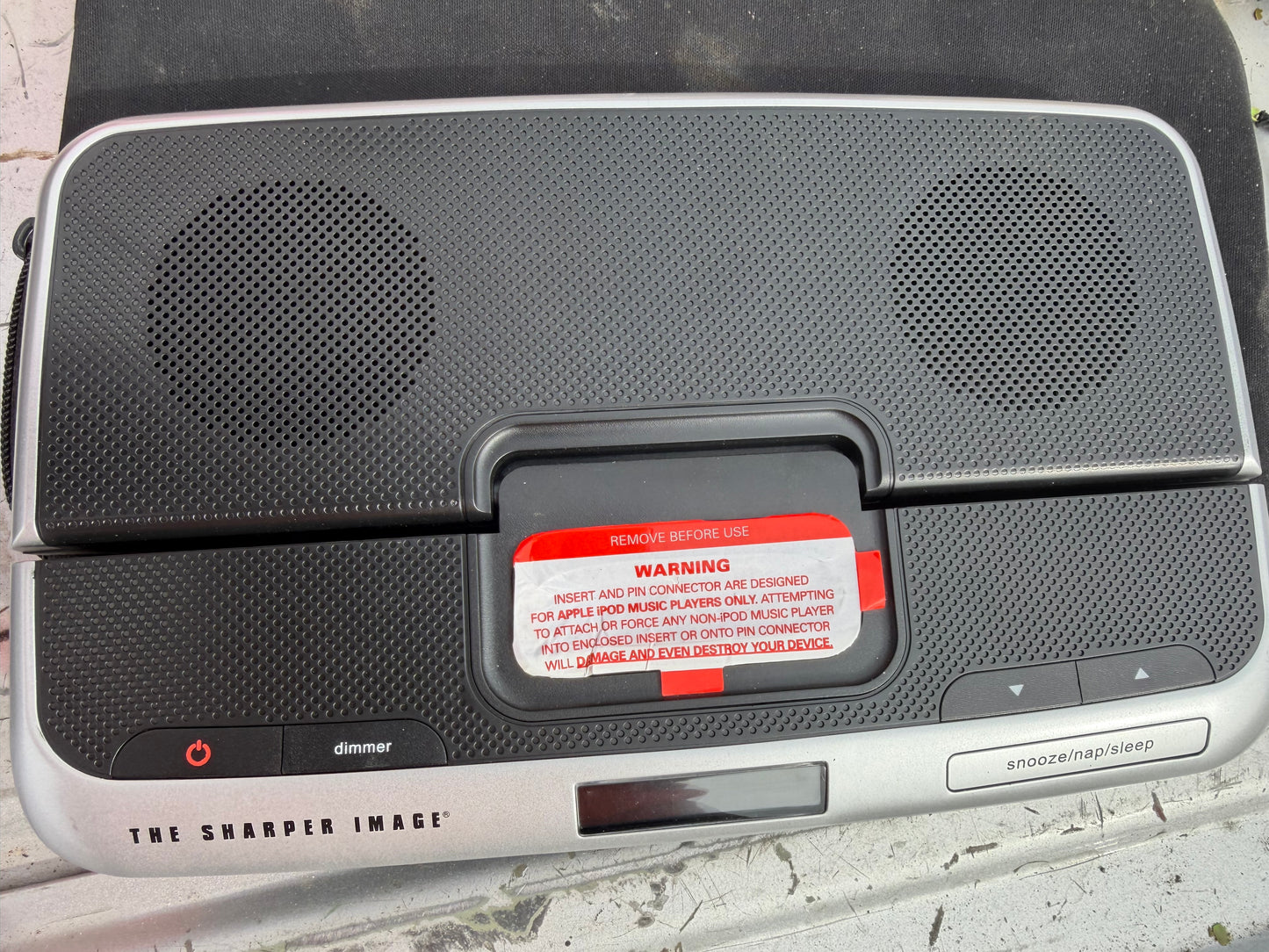 The Sharper Image docking for phone music. New with case …
