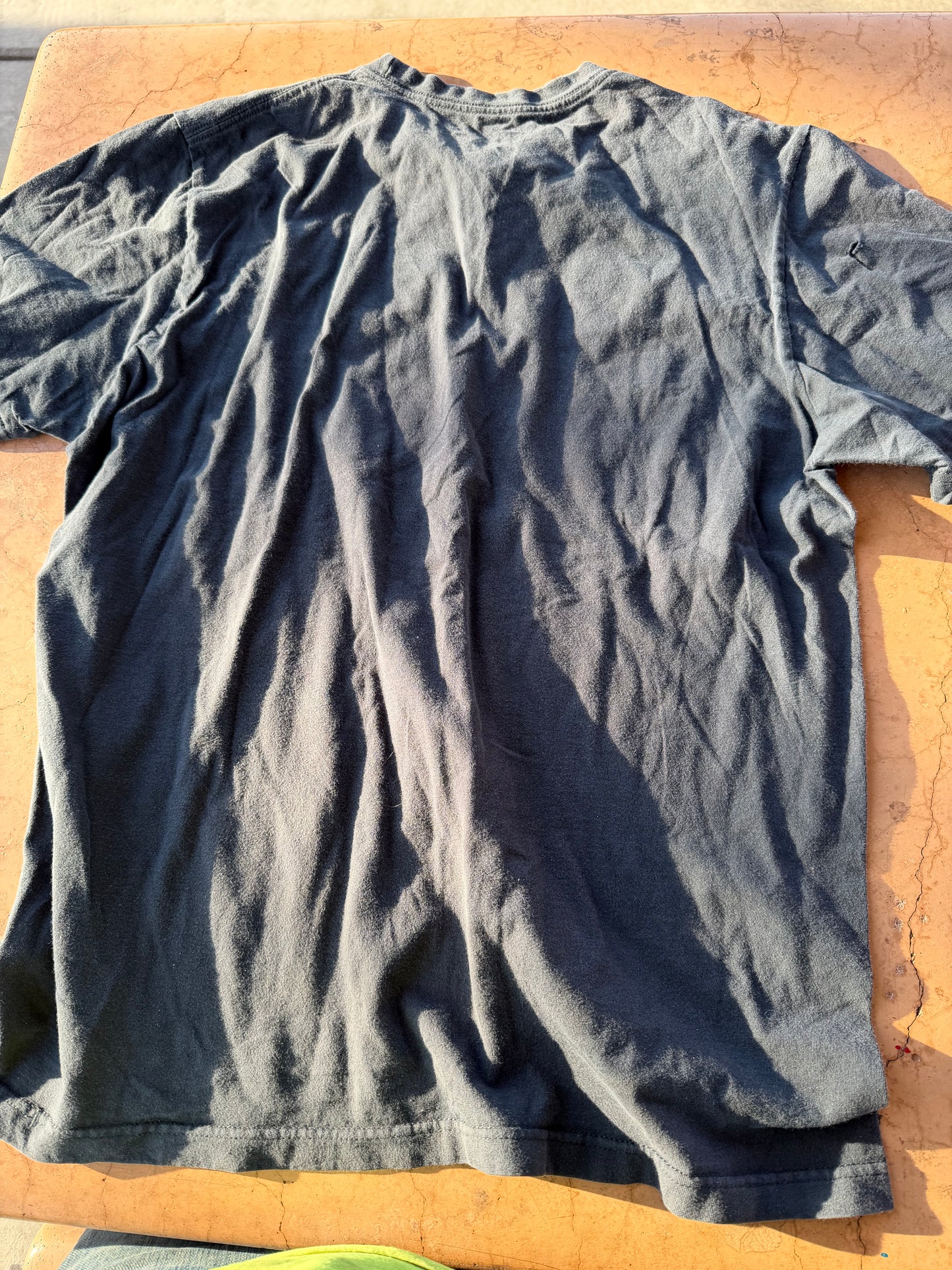 Nike tee shirt  gray with skull and football helmet on it size Large …