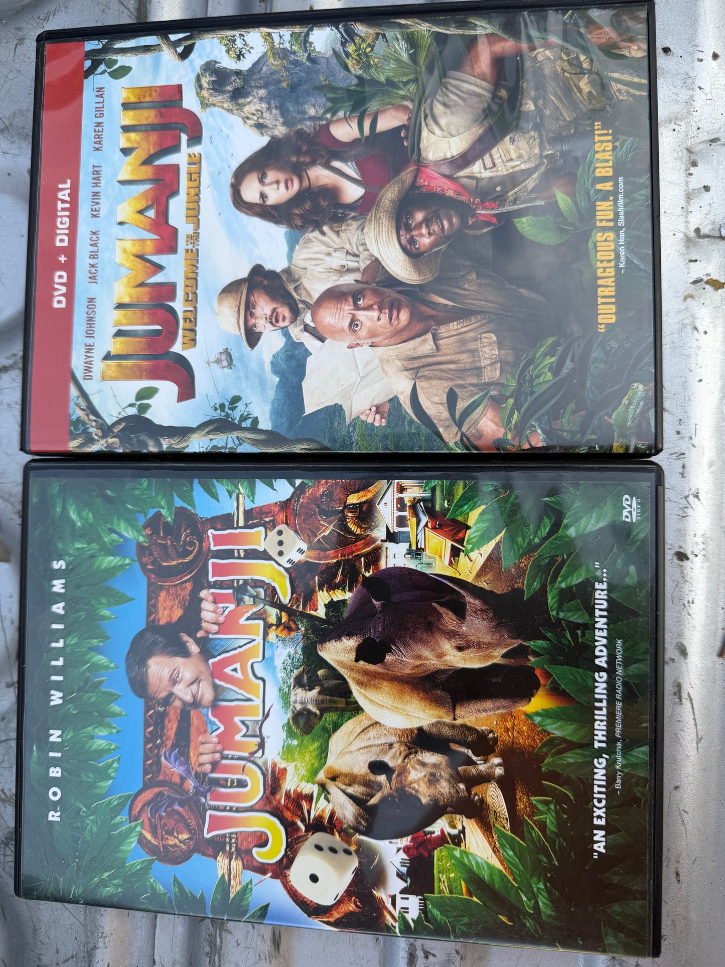 Jumanji 1-2 DVDs movies with Robin Williams the second with Dwayne Johnson used …