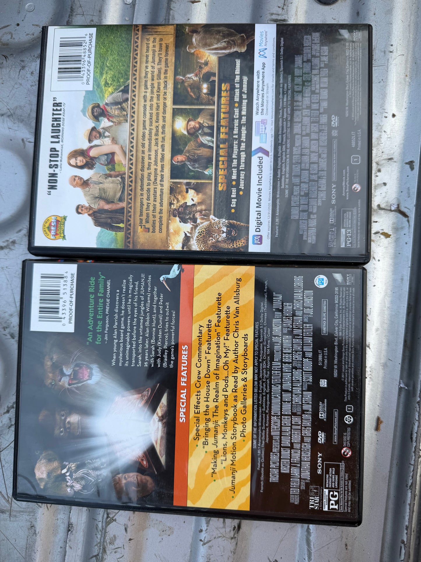 Jumanji 1-2 DVDs movies with Robin Williams the second with Dwayne Johnson used …