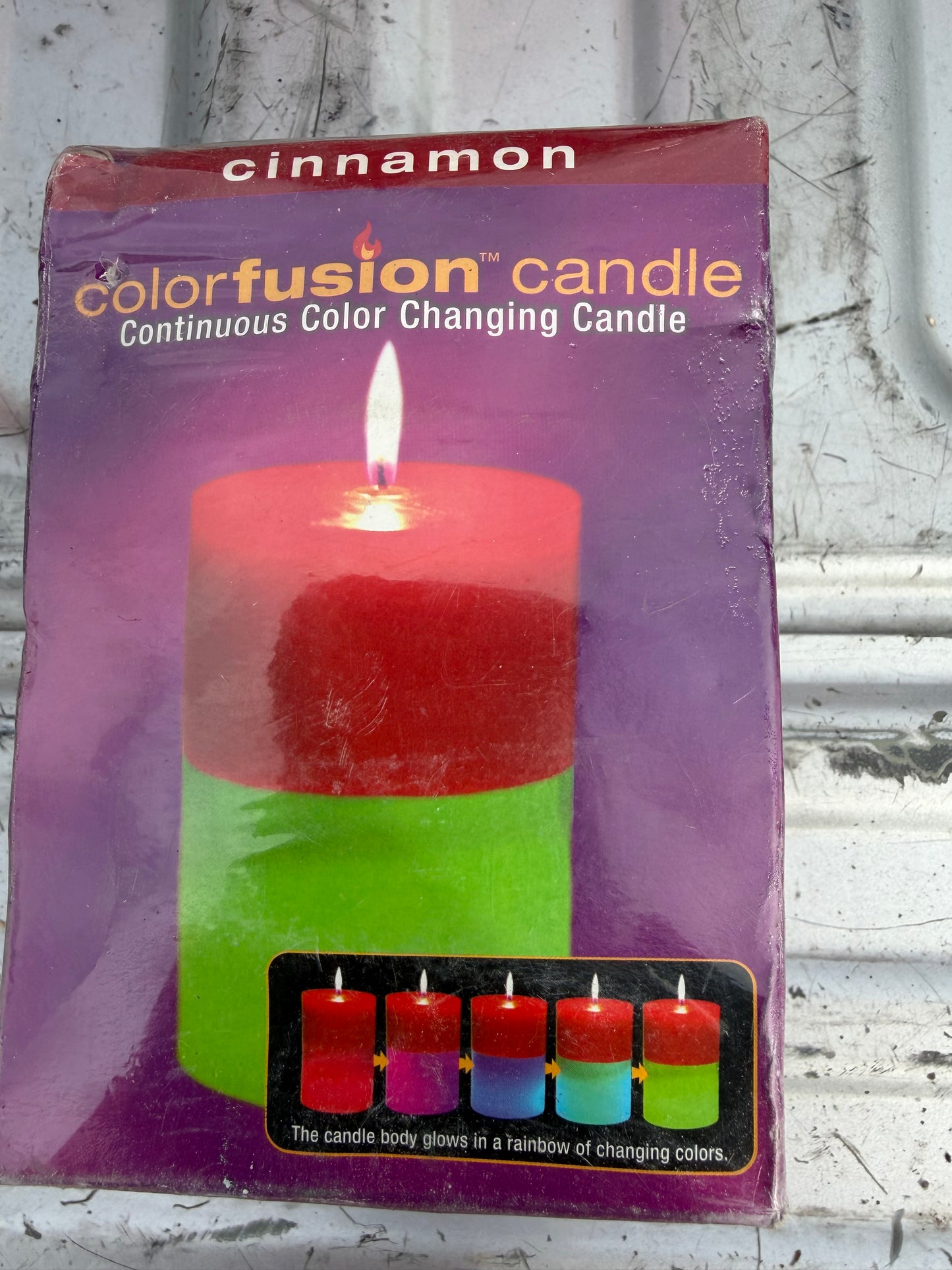Color fusion candle changing colors new in box dented Cinnamon…