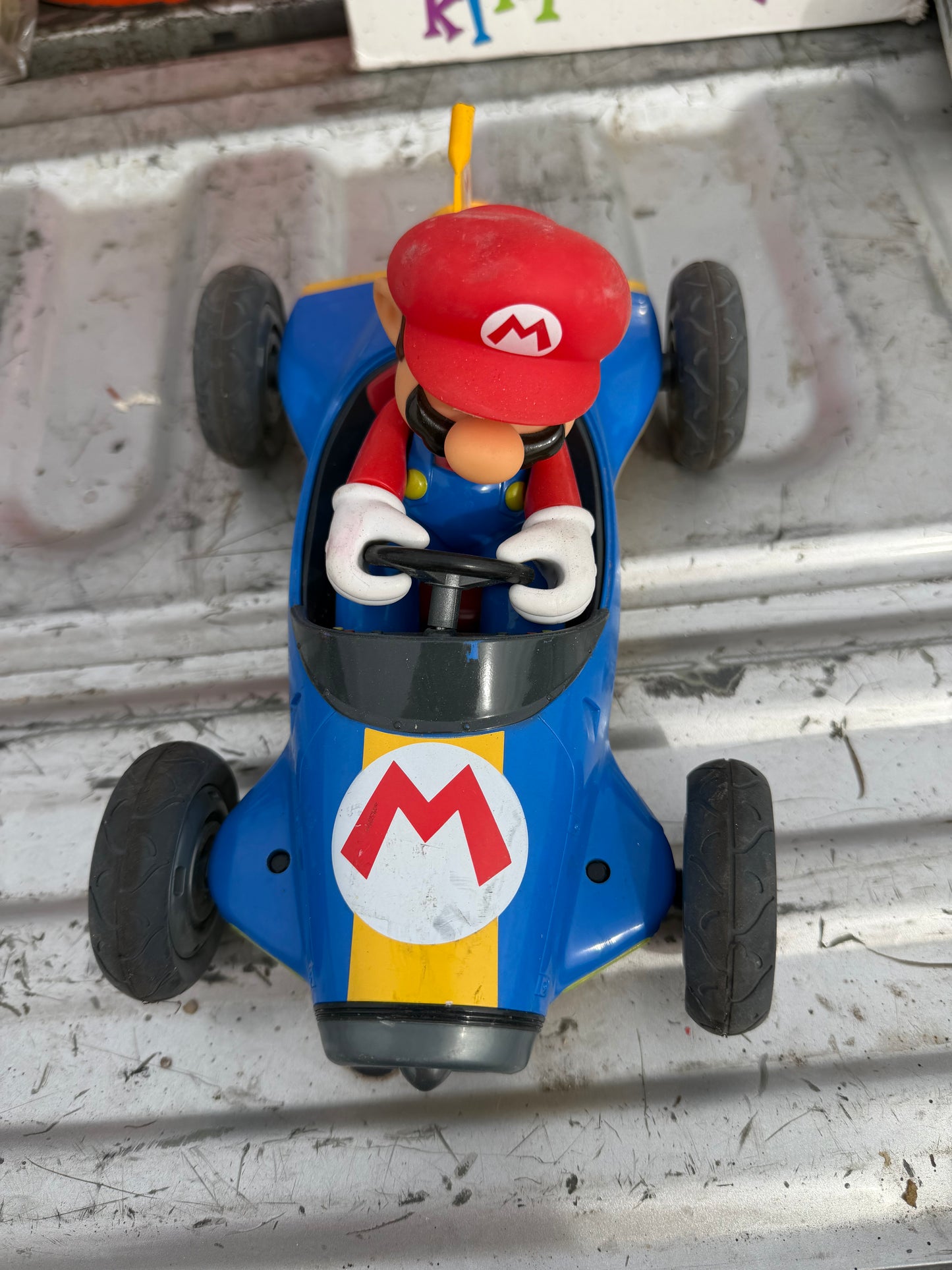 Mario’s car 10 inches long driving Mario’s cart. No battery…