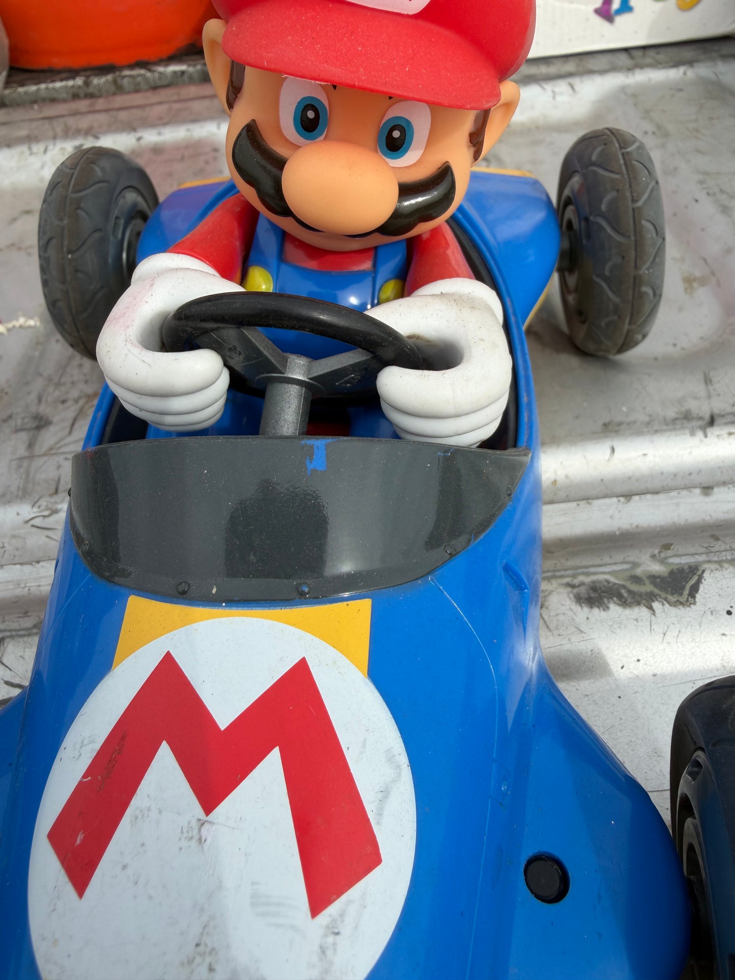 Mario’s car 10 inches long driving Mario’s cart. No battery…